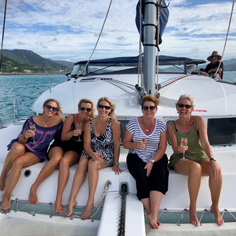 a group of people in a boat on a body of water