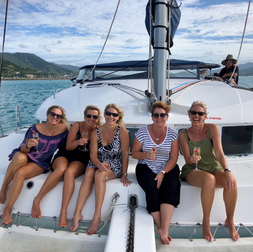 3 a group of people in a boat on a body of water