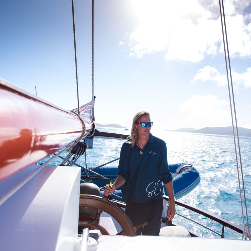 a man riding on the back of a boat