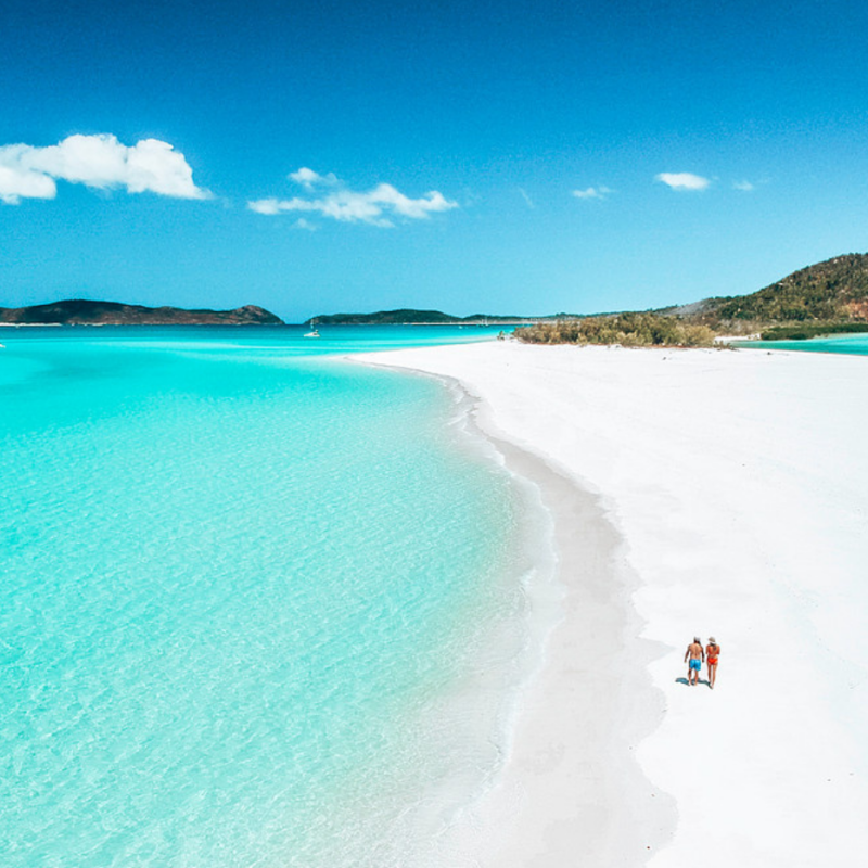a body of water with Whitehaven Beach in the background
