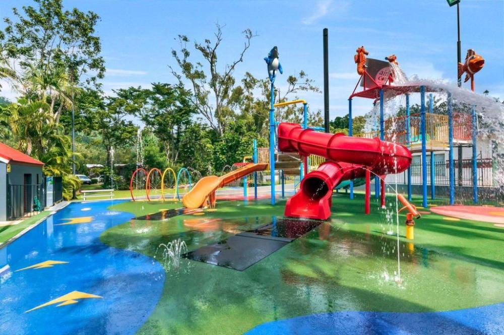 a group of people in a pool of water