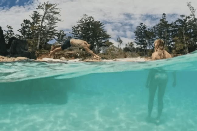 a group of people swimming in the water