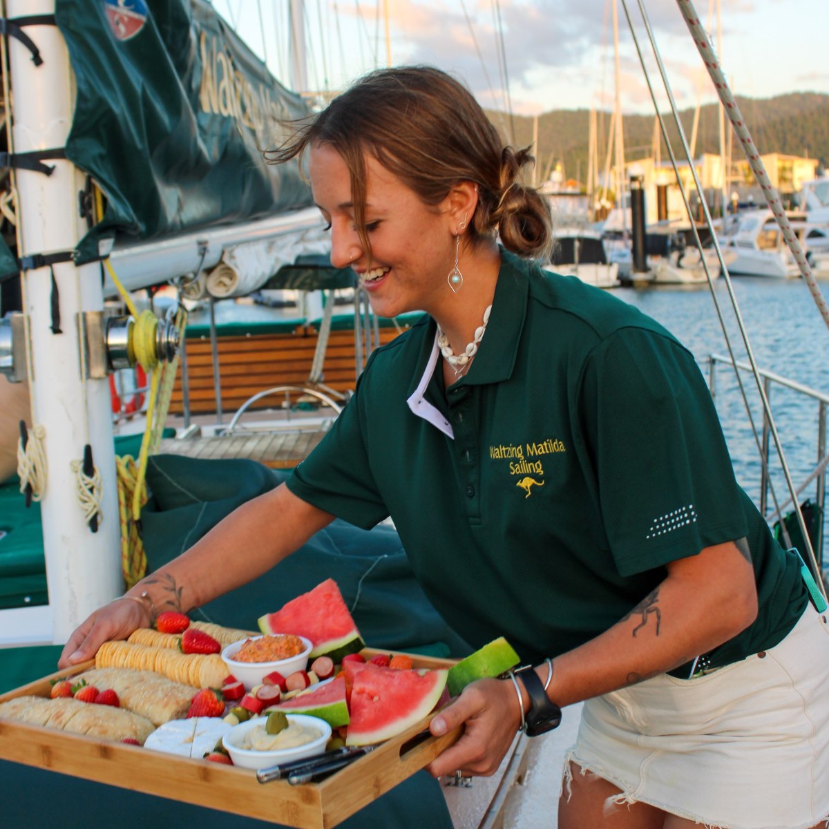 a man and a woman standing in front of a boat